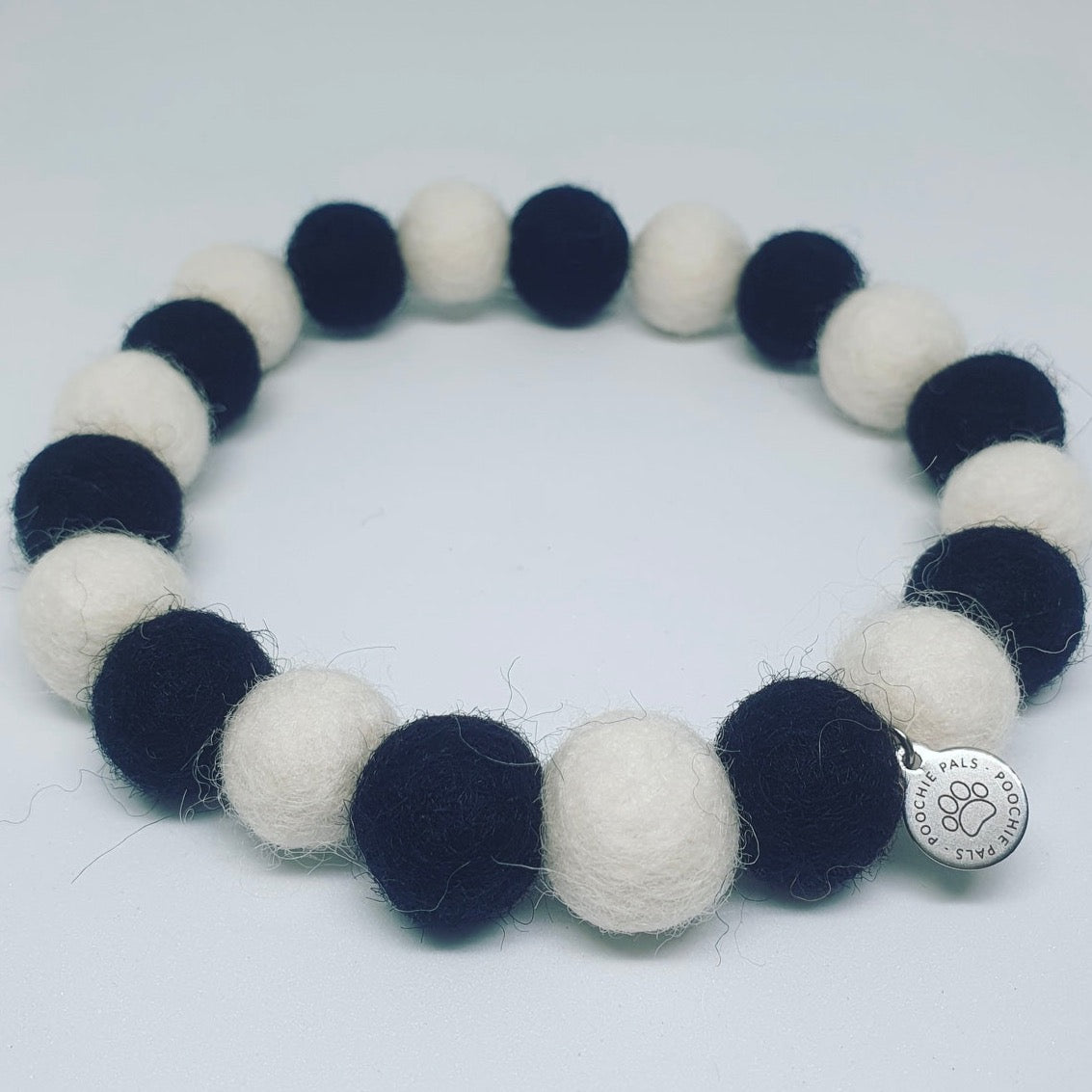 black and white Pom Pom pet dog cat necklace collar. handmade from wool in cornwall
